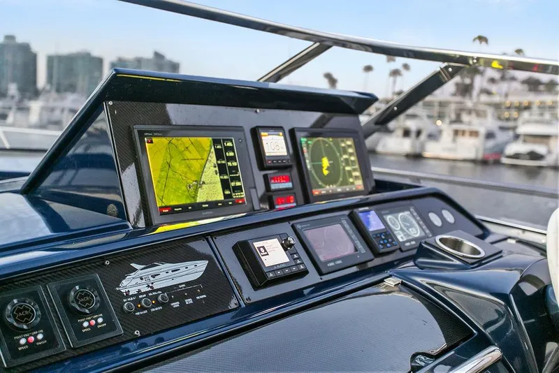 Slide: The Image of Control panel of a 2004 Riva 59 Mercurius yacht with navigation screens and instruments. - 20