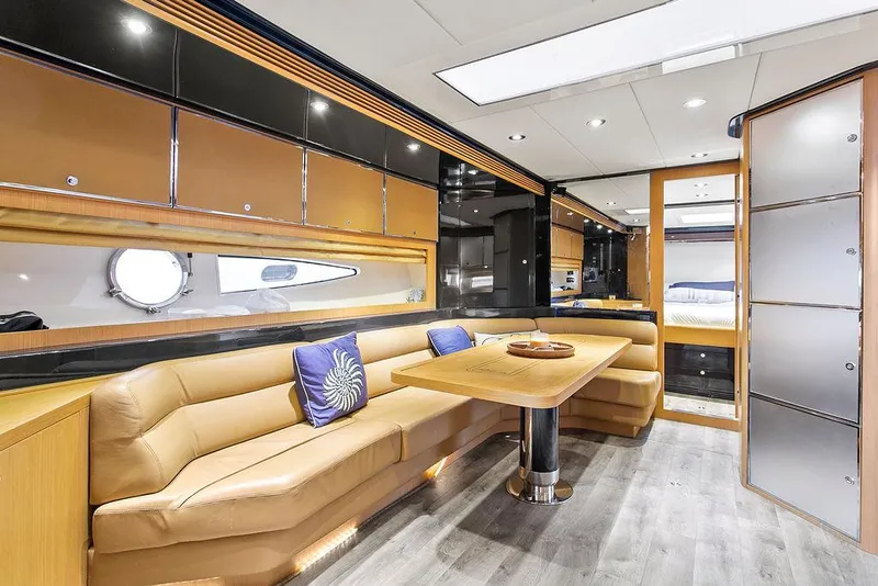 Slide: The Image of Luxurious interior of a 2004 Riva 59 Mercurius yacht with elegant seating and modern design. - 21