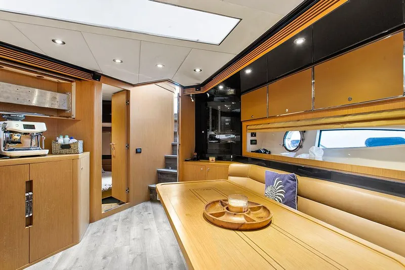 Slide: The Image of Luxurious interior of a 2004 Riva 59 Mercurius yacht with modern amenities. - 23