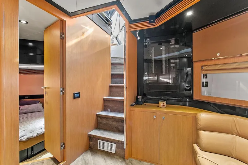 Slide: The Image of Interior of 2004 Riva 59 Mercurius yacht with wooden cabinetry and modern design. - 25