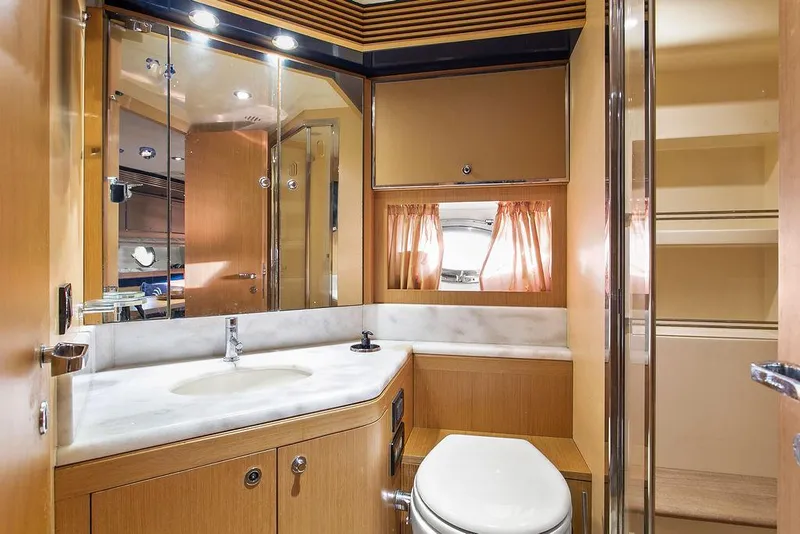 Slide: The Image of Luxurious bathroom interior of 2004 Riva 59 Mercurius yacht with modern fixtures and wood accents. - 27