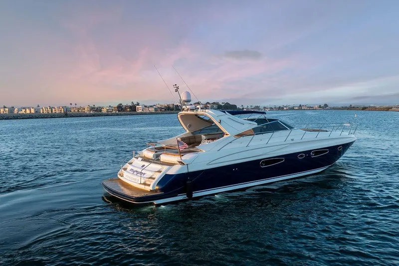 Slide: The Image of 2004 Riva 59 Mercurius yacht cruising on serene waters at sunset. - 4