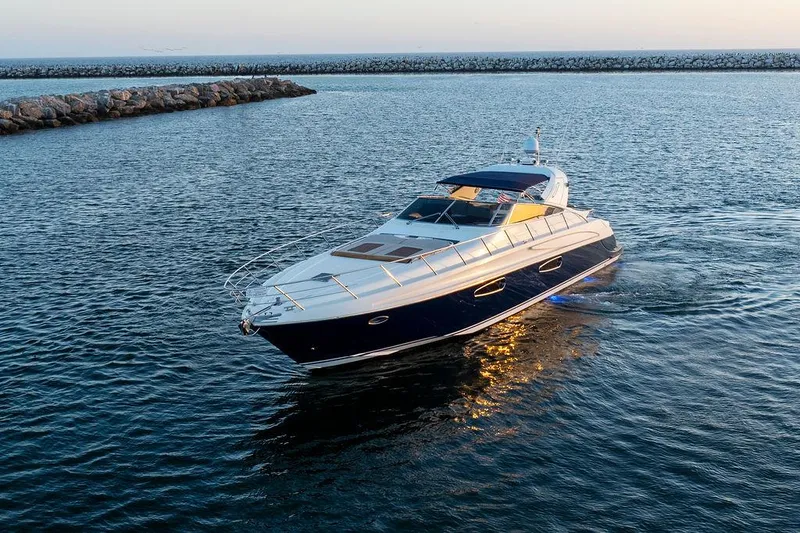 Slide: The Image of Luxury Riva 59 Mercurius yacht cruising on calm waters at sunset, 2004 model. - 5