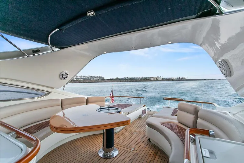 Slide: The Image of Luxurious 2004 Riva 59 Mercurius yacht interior with elegant seating and ocean view. - 8