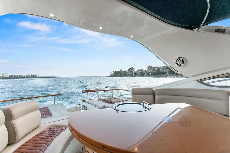 Slide: The Image of Luxurious 2004 Riva 59 Mercurius yacht interior with ocean view and elegant seating. - 9