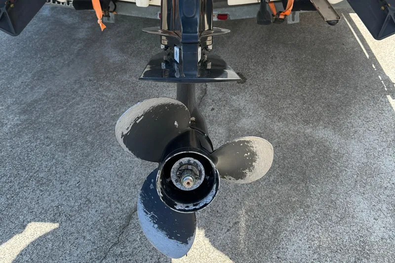 Slide: The Image of Propeller of a 2013 Carolina Skiff 218 DLV boat on concrete surface. - 15