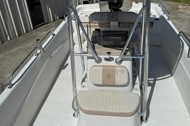Slide: The Image of 2013 Carolina Skiff 218 DLV boat interior with seating and console. - 18