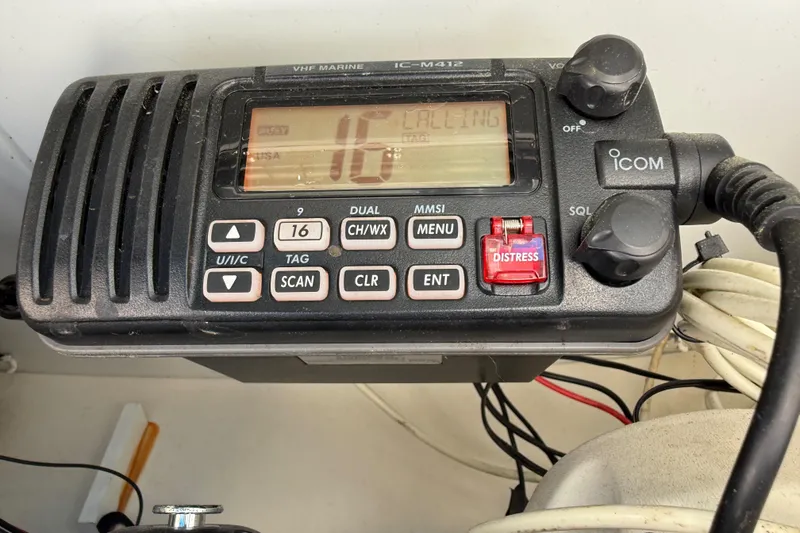 Slide: The Image of VHF marine radio on 2013 Carolina Skiff 218 DLV, displaying channel 16. - 20
