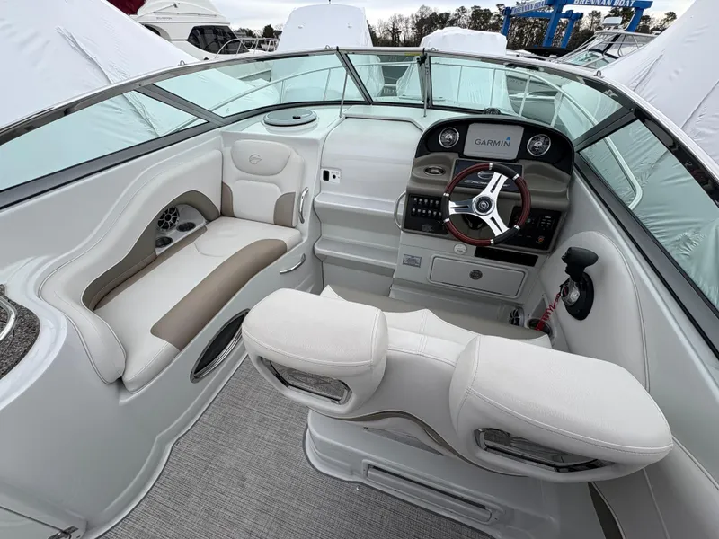 Slide: The Image of 2023 Crownline 264 CR boat interior with modern helm and seating. - 7