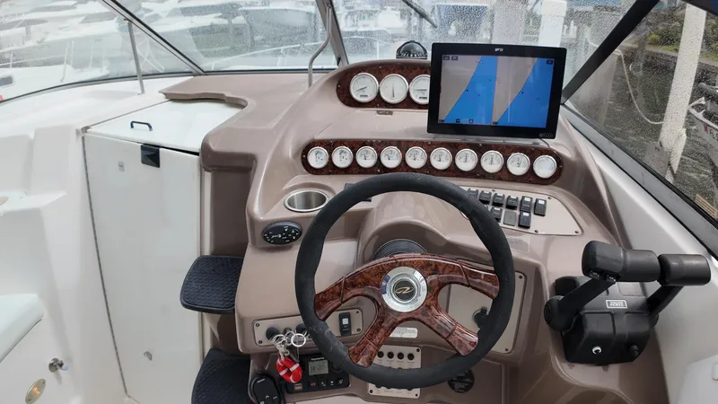 Slide: The Image of Helm of 2005 Regal Commodore 2860 with steering wheel, gauges, and navigation screen. - 16