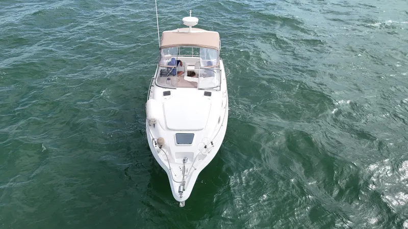 Slide: The Image of 2005 Regal Commodore 2860 boat cruising on open water. - 2