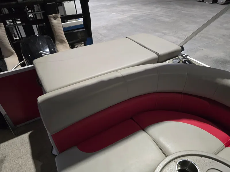 Slide: The Image of 2022 Premier 210 SunSation RE boat interior with red and gray seating. - 11