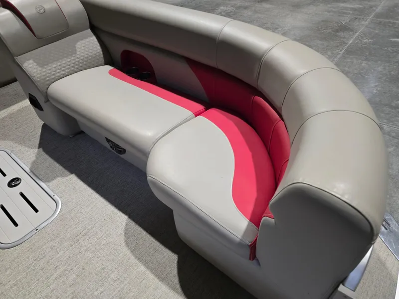 Slide: The Image of 2022 Premier 210 SunSation RE boat seating with beige and red upholstery. - 16