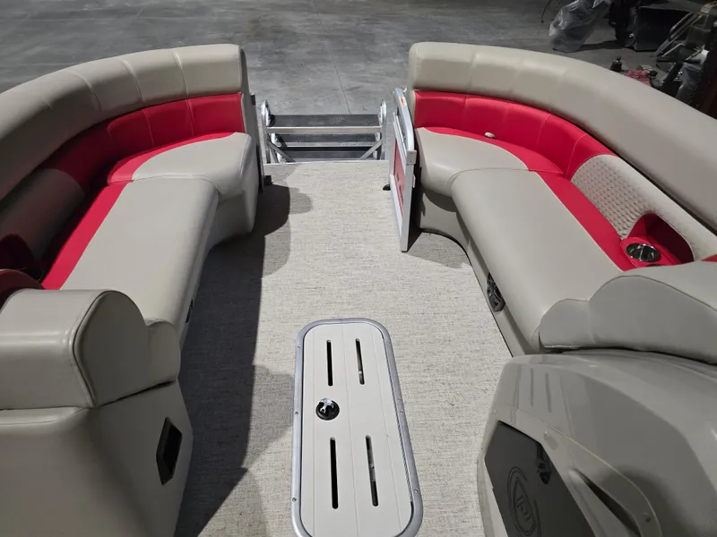 Slide: The Image of 2022 Premier 210 SunSation RE pontoon boat interior with beige and red seating. - 4