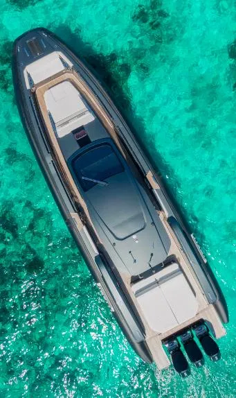 Slide: The Image of Aerial view of 2025 Pirelli 50 yacht on clear turquoise water. - 2