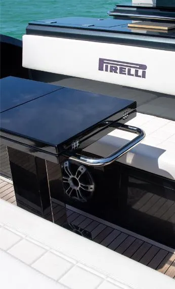 Slide: The Image of Pirelli 50 yacht interior, sleek black and white design, 2025 model. - 4