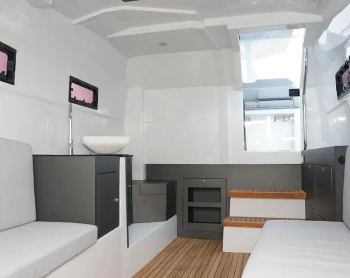 Slide: The Image of Interior of 2025 Pirelli 50 boat with modern seating and wooden flooring. - 6