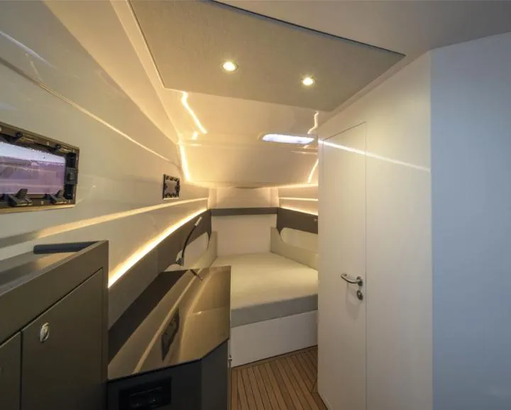 Slide: The Image of Modern interior of 2025 Pirelli 50 yacht cabin with sleek design and ambient lighting. - 7