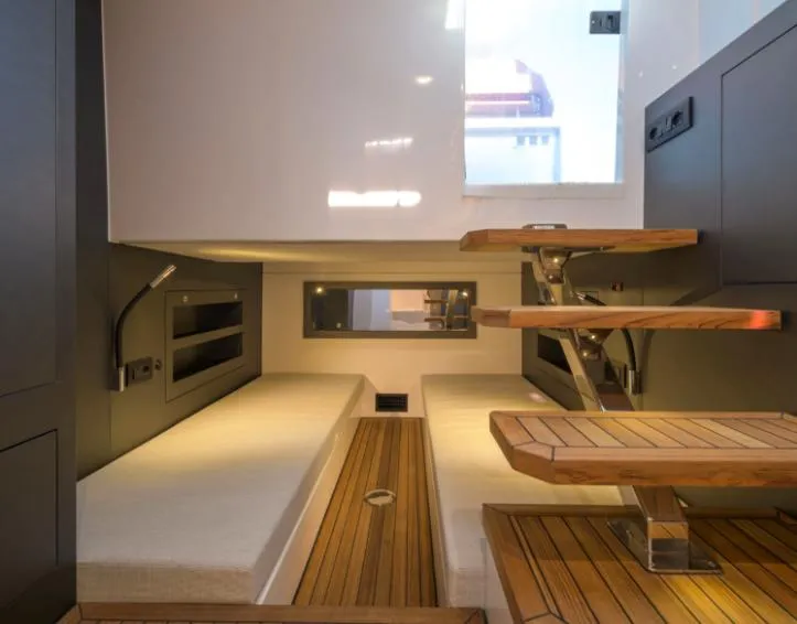Slide: The Image of Interior of 2025 Pirelli 50 yacht with modern wooden stairs and cozy seating area. - 8