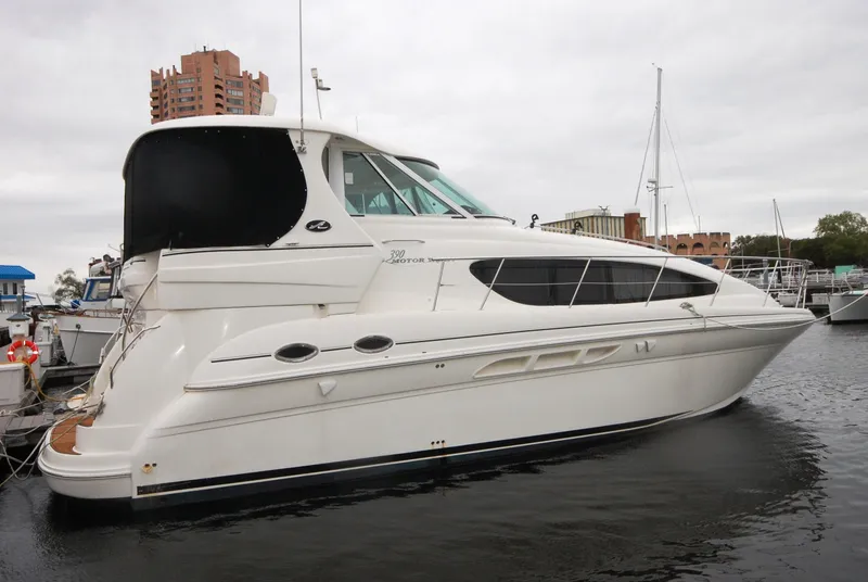 Slide: The Image of 2005 Sea Ray 390 Motor Yacht docked in marina, side view. - 1