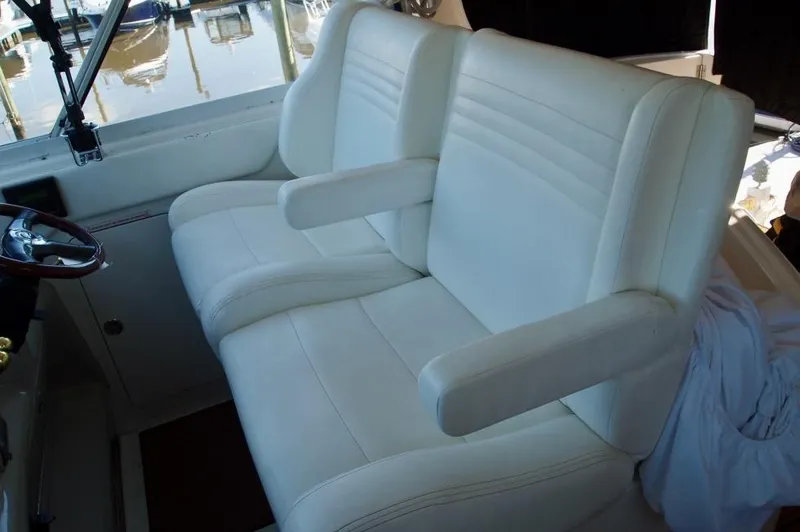 Slide: The Image of 2005 Sea Ray 390 Motor Yacht interior with white leather seating. - 10