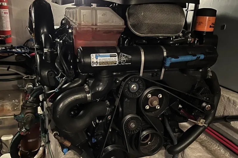 Slide: The Image of Engine of a 2005 Sea Ray 390 Motor Yacht, showcasing intricate components and design. - 13