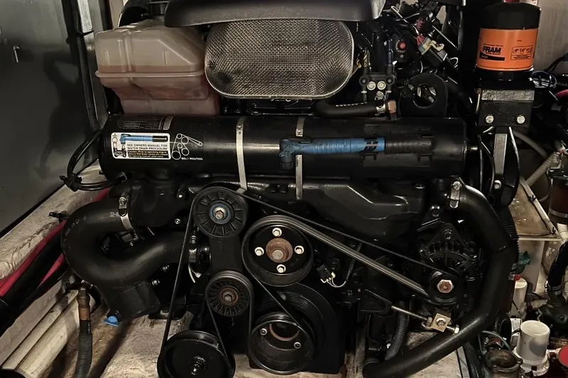 Slide: The Image of Engine of a 2005 Sea Ray 390 Motor Yacht, showcasing mechanical components and belts. - 14