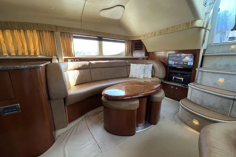 Slide: The Image of Luxurious interior of 2005 Sea Ray 390 Motor Yacht with plush seating and elegant design. - 19