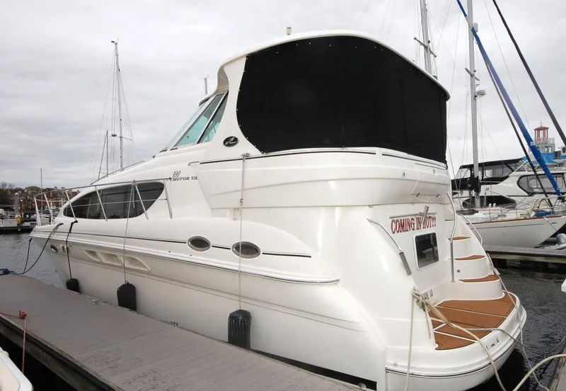 Slide: The Image of 2005 Sea Ray 390 Motor Yacht docked at marina, rear view. - 2