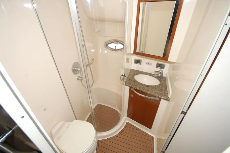 Slide: The Image of 2005 Sea Ray 390 Motor Yacht bathroom with shower, sink, and toilet. - 24