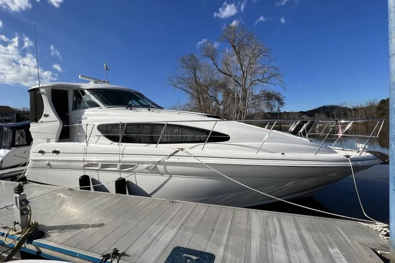Slide: The Image of 2005 Sea Ray 390 Motor Yacht docked under clear blue sky. - 3