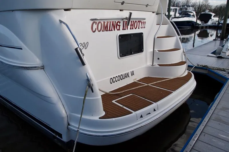 Slide: The Image of 2005 Sea Ray 390 Motor Yacht docked, featuring "COMING IN HOT!!!" text on the stern. - 33