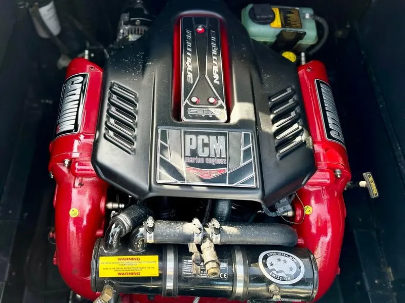 Slide: The Image of 2015 Nautique Super Air Nautique G21 engine, PCM marine engine with red accents. - 10