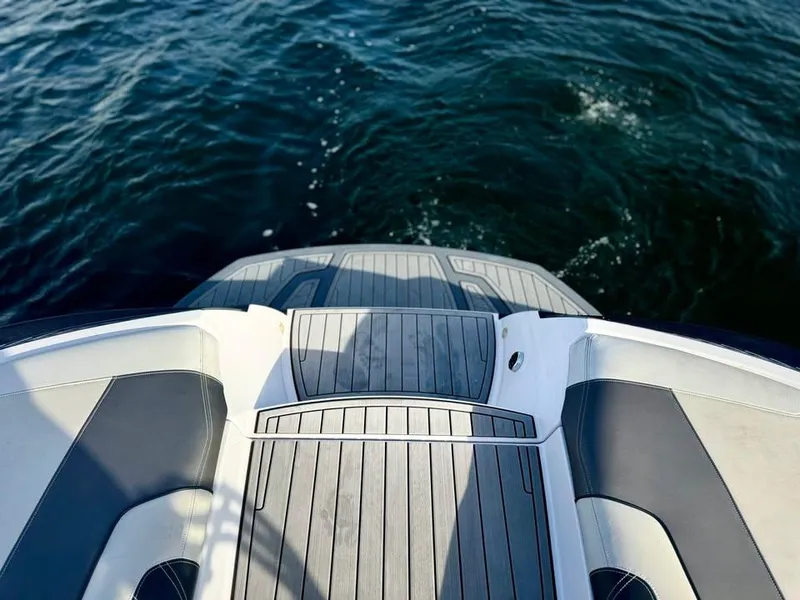 Slide: The Image of 2015 Nautique Super Air Nautique G21 boat deck overlooking water. - 6
