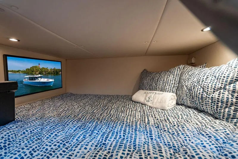 Slide: The Image of 2024 MJM 4 boat cabin with cozy bedding and scenic window view. - 29