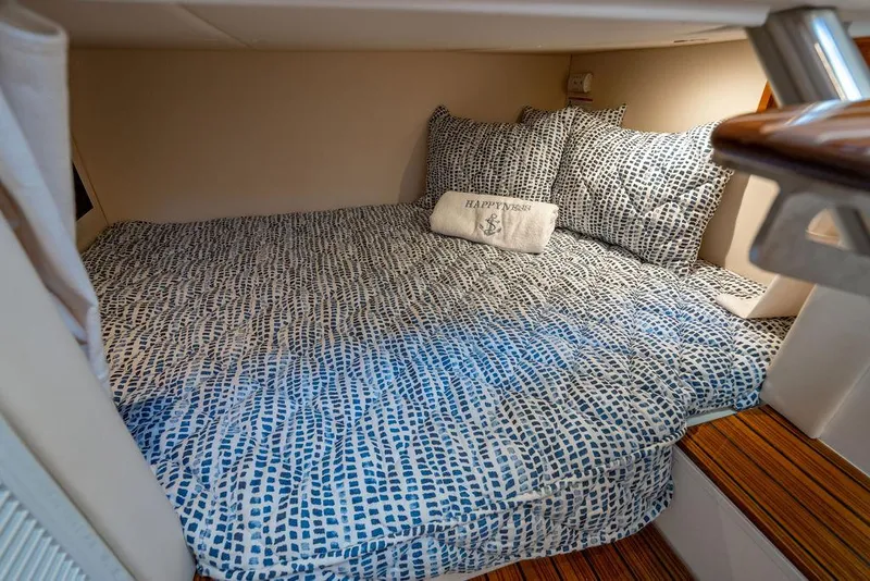 Slide: The Image of 2024 MJM 4 boat cabin with cozy bedding and decorative pillow. - 30