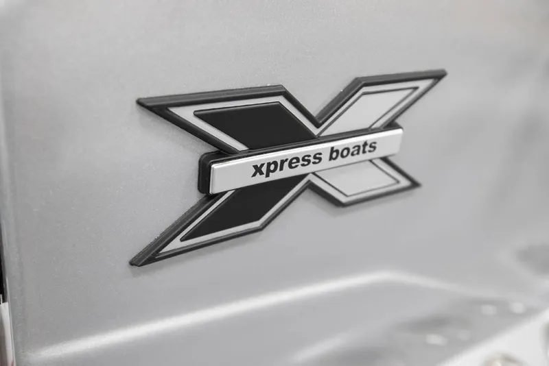 Slide: The Image of Xpress Boats logo on 2020 Xpress X23B model, featuring bold 'X' design. - 5