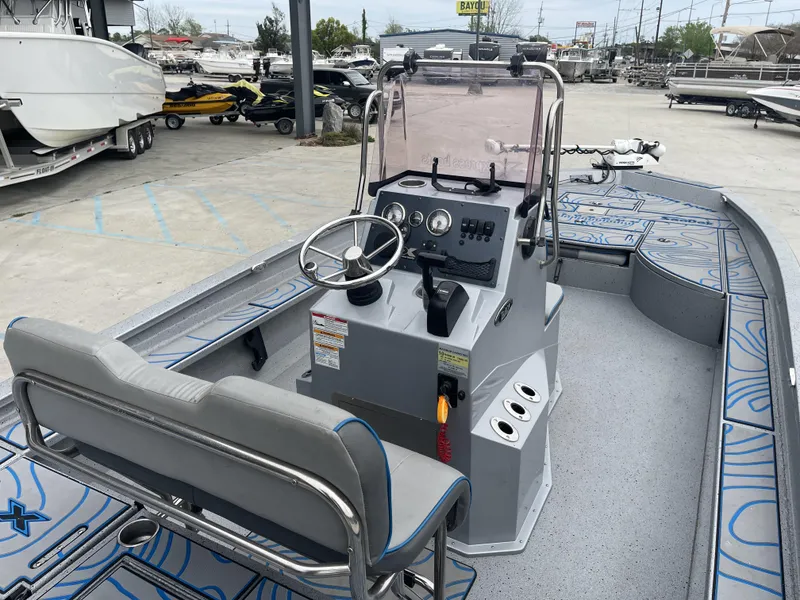 Slide: The Image of 2020 Xpress X23B boat with center console and seating, displayed in a marina setting. - 8