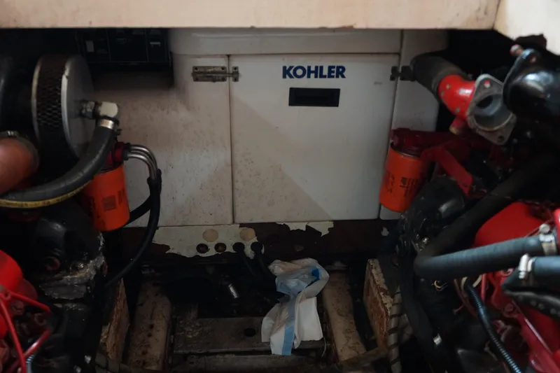 Slide: The Image of Engine room of 1986 President 37 Sundeck with Kohler generator and visible components. - 7