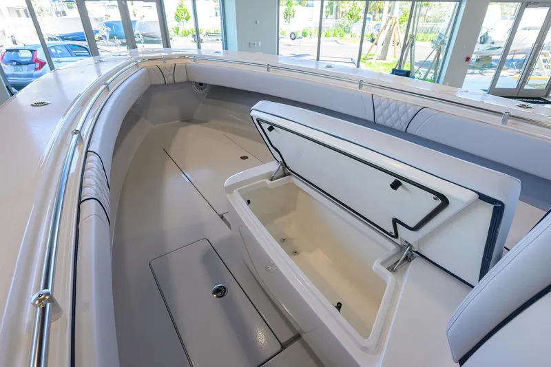 Slide: The Image of 2025 Contender 32 ST boat interior with open storage compartment, showcasing sleek design and spacious layout. - 12