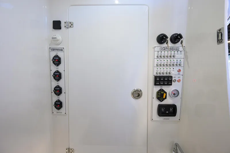 Slide: The Image of Control panel of 2025 Contender 32 ST boat, featuring switches and gauges. - 23