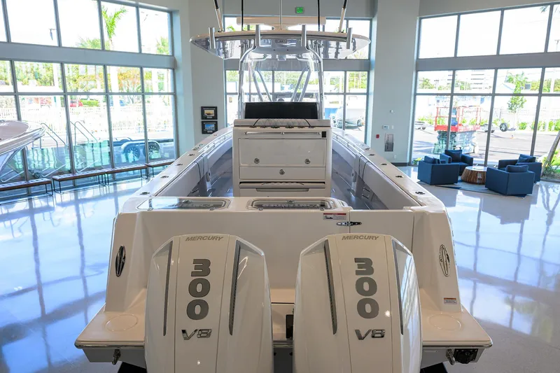 Slide: The Image of 2025 Contender 32 ST boat with dual 300 V8 engines in showroom. - 29