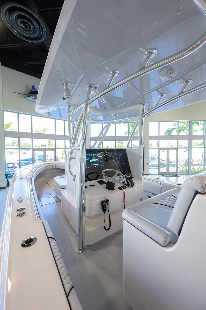 Slide: The Image of 2025 Contender 32 ST boat interior with modern console and seating. - 3
