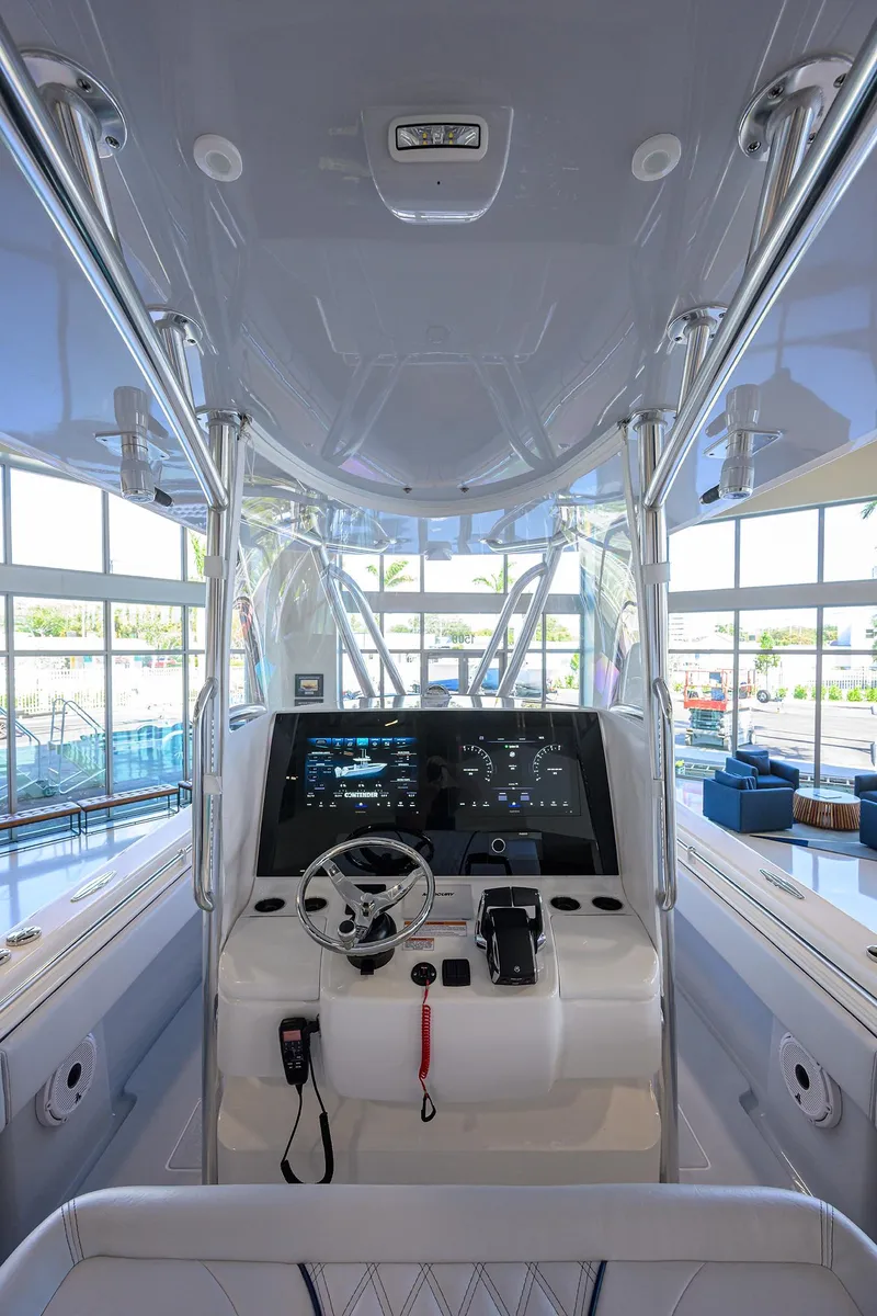 Slide: The Image of 2025 Contender 32 ST boat interior with modern helm and navigation system. - 4