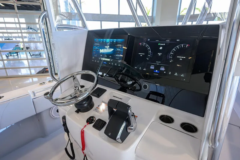 Slide: The Image of 2025 Contender 32 ST boat dashboard with modern controls and digital displays. - 5