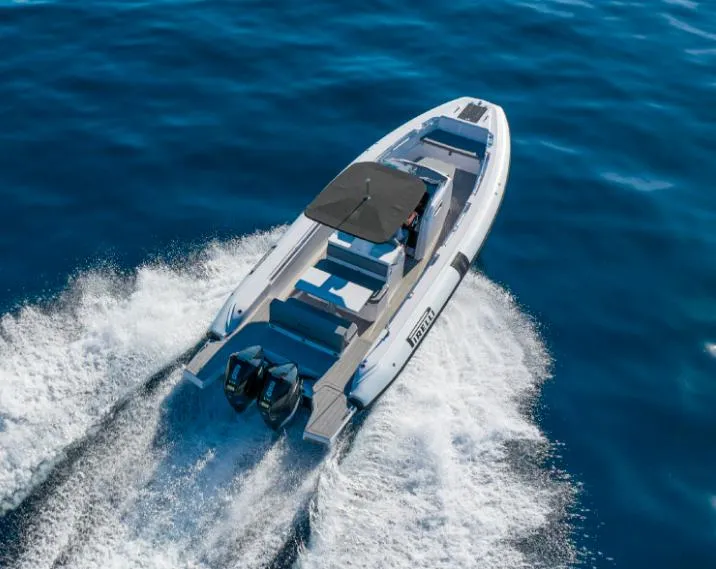 Slide: The Image of 2025 Pirelli 30 boat cruising on open water, aerial view. - 3