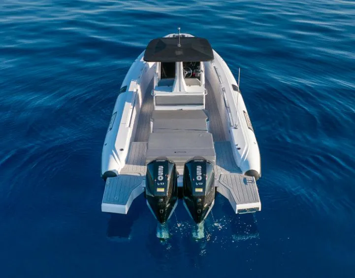 Slide: The Image of Pirelli 30 boat, 2025 model, with dual engines on calm blue water. - 4