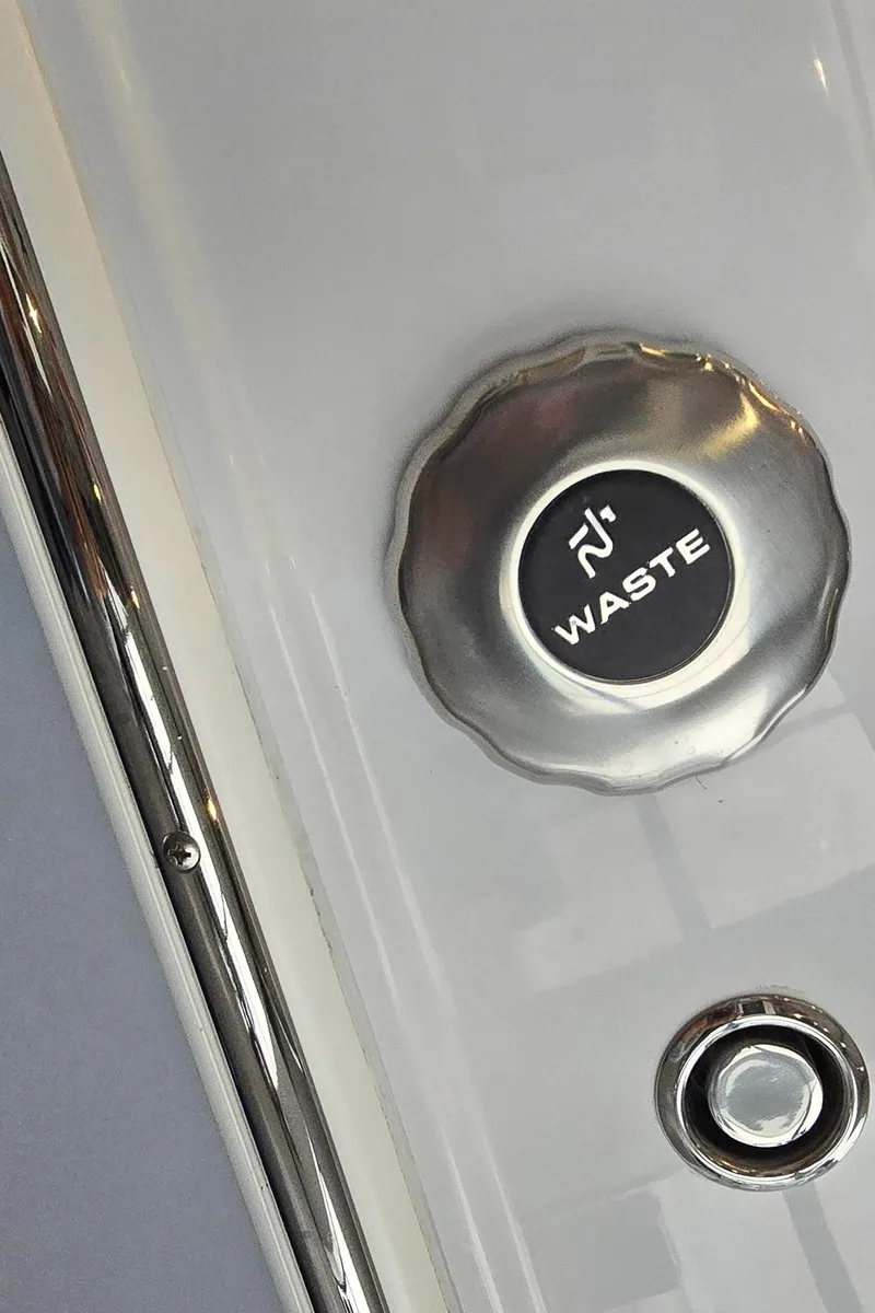 Slide: The Image of Waste cap on 2025 Stingray 211DC boat, metallic finish. - 25