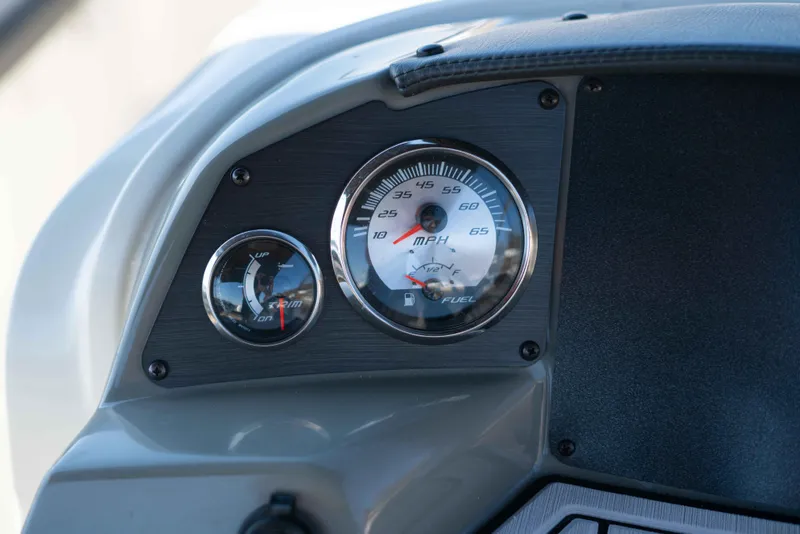 Slide: The Image of Dashboard of a 2019 Stingray 212 SC boat showing speedometer and fuel gauge. - 22