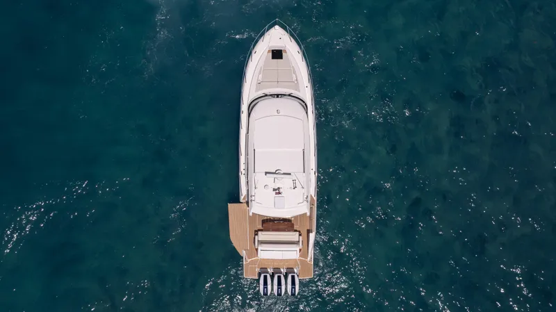 Slide: The Image of 2024 Tiara Yachts 48 LE, aerial view, cruising on open water. - 12